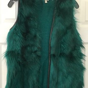 Fur vest with black faux leather trim